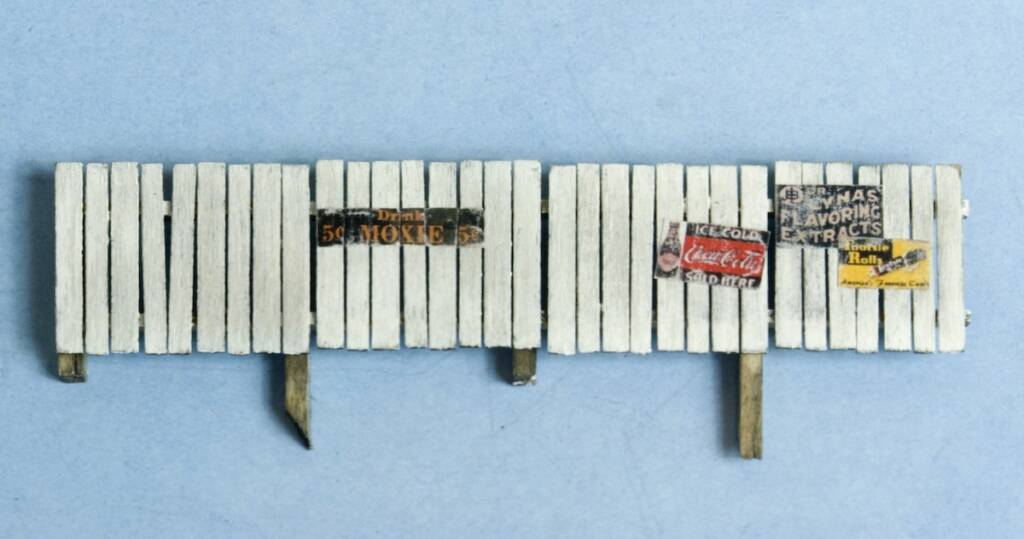 model fence with signs