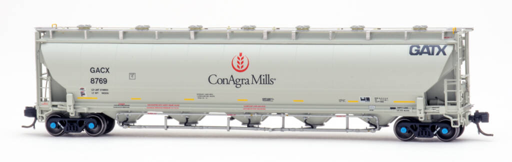 Color photo of N scale covered hopper painted gray with black, red, and yellow graphics on white background.