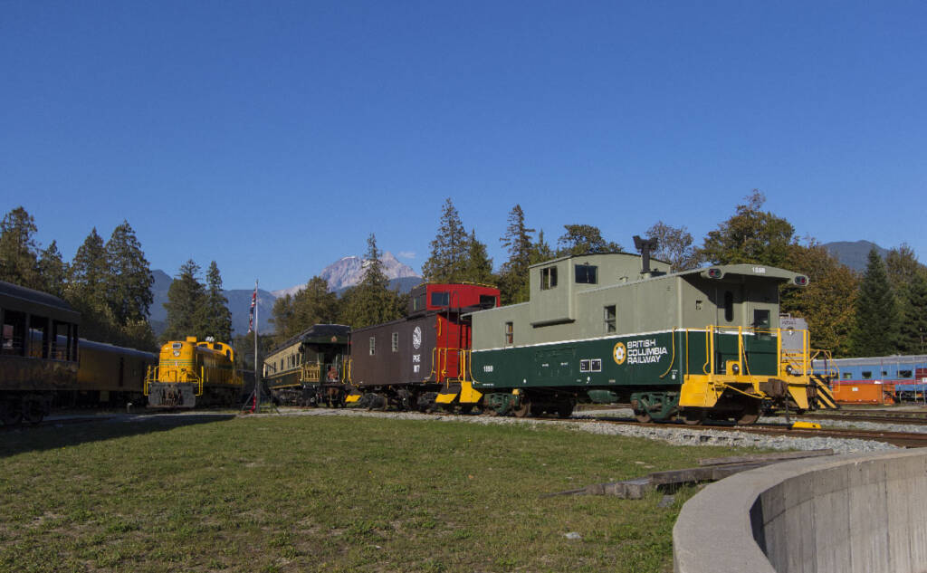 Several cabooses in a museum setting. British Columbia museum receives grant for shop restoration.