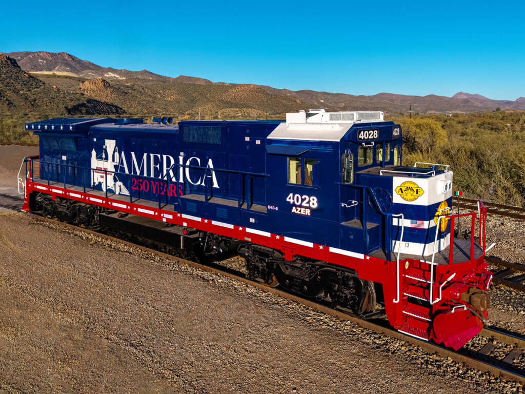 Red, white, and blue locomotive in desert