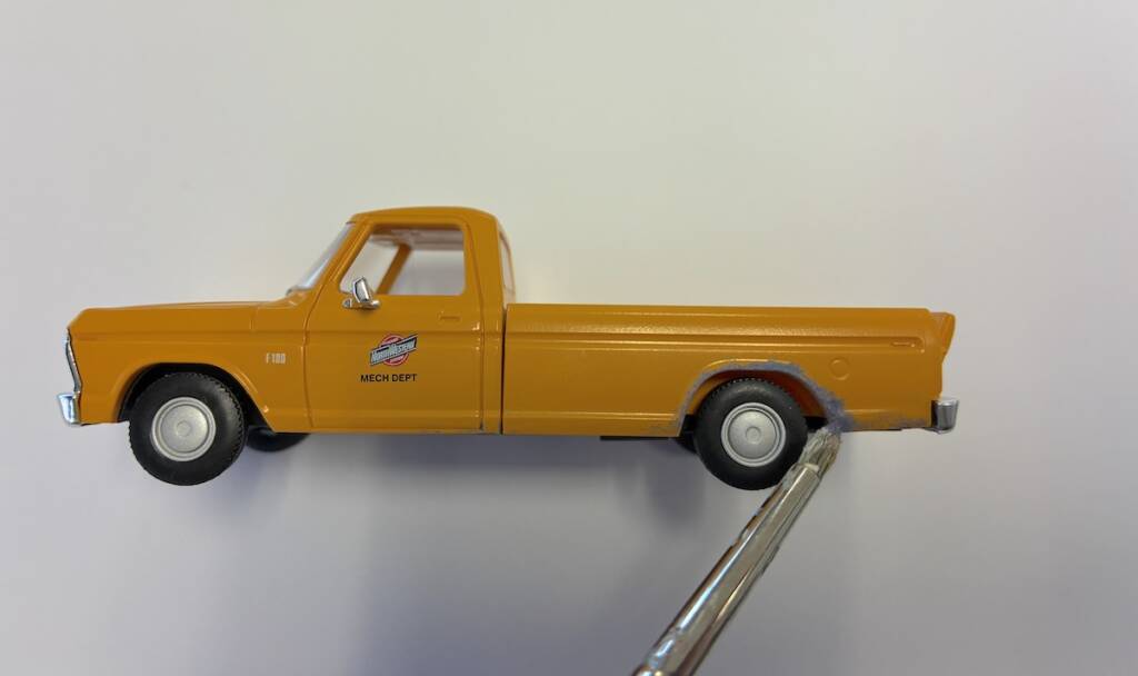 paint brush and yellow truck model