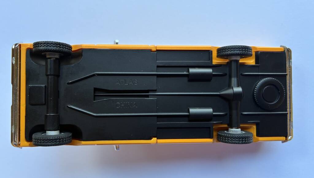 underside of yellow model truck