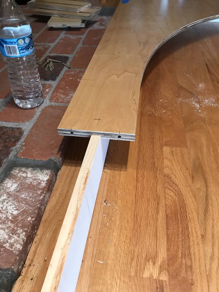 section of wood on top of a longer piece of wood