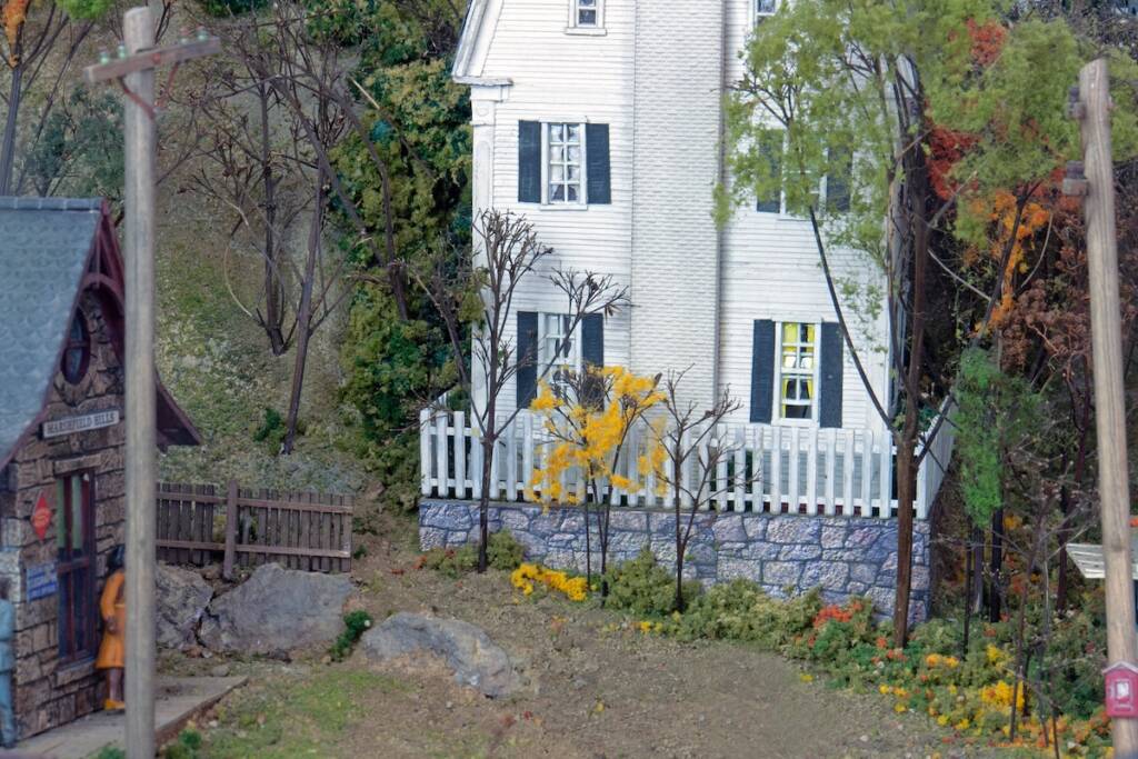 two model houses with fences