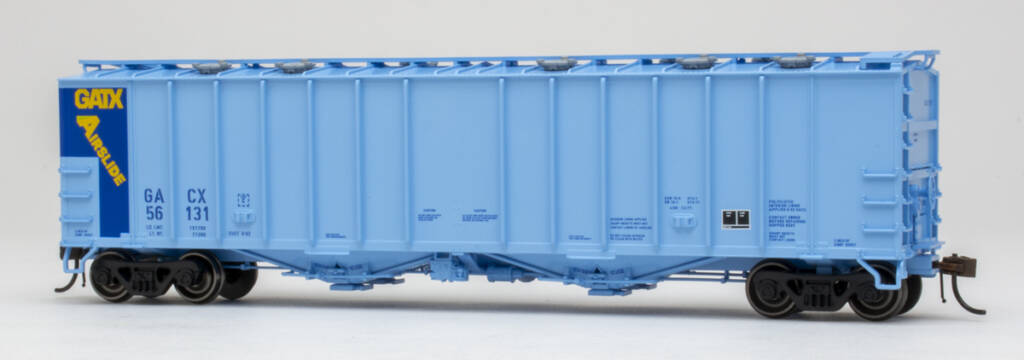 Color photo of HO scale covered hopper painted two-tone blue with yellow, blue, black, and white graphics on white background. 