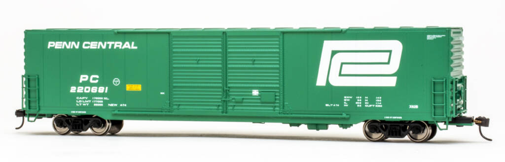Color photo of HO scale double-door boxcar painted Deepwater Green with white and yellow graphics on white background.