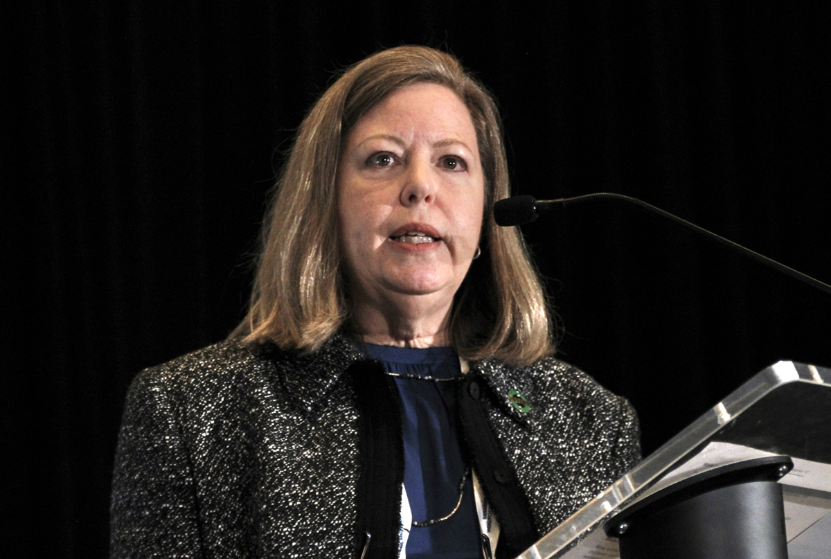 Woman speaking at podium