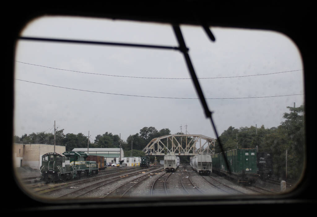 View of rail yard through locomotive window