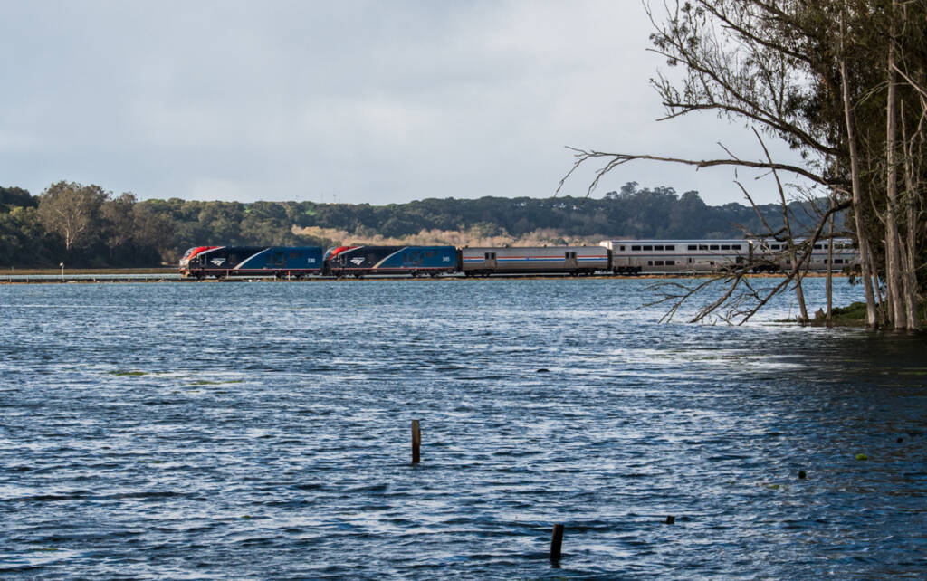 passenger train on track just barely above water