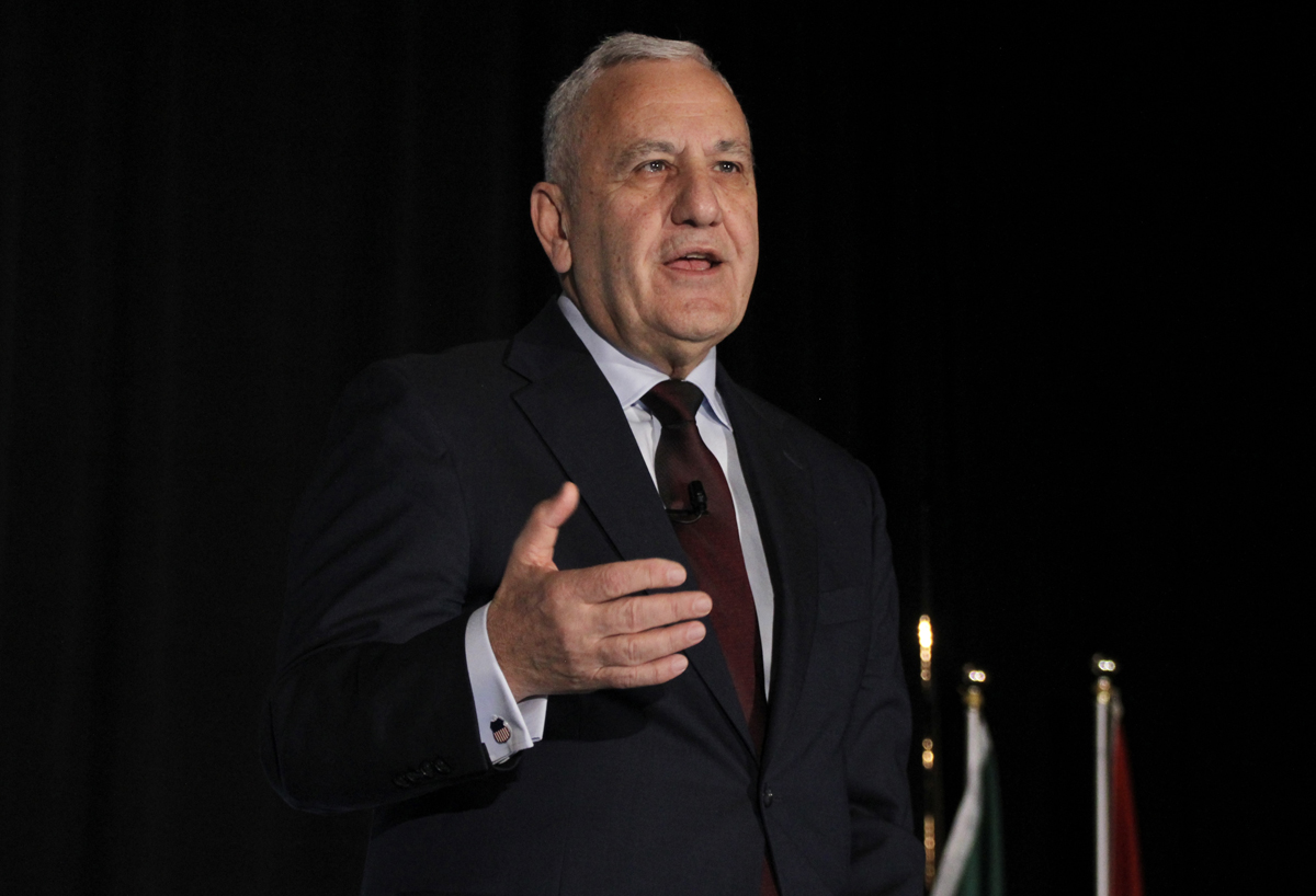 Man gestures while speaking