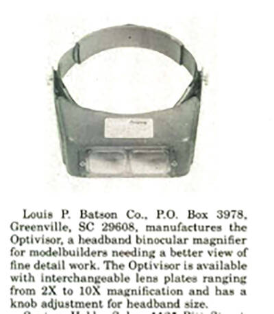 Black and white clipping from a vintage magazine page showing a gray goggle with clear lenses and a gray head strap over the top of a paragraph of black text printed on white paper.