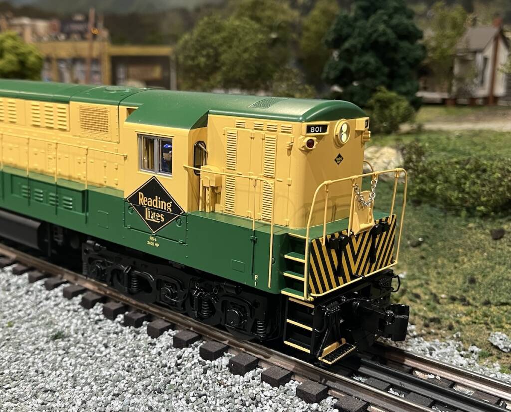 end of yellow and green model diesel locomotive