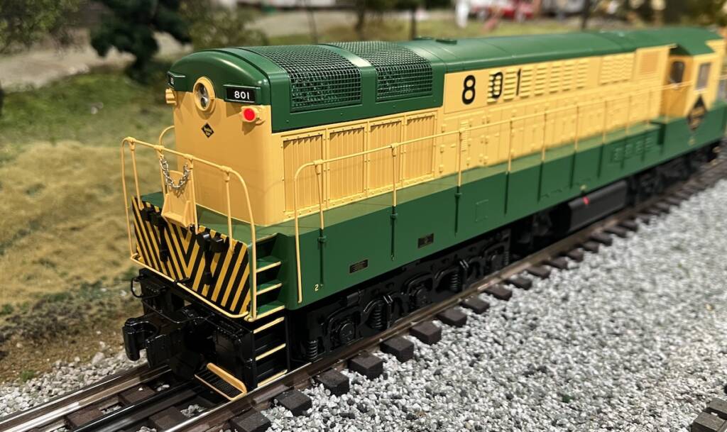end of yellow and green model diesel locomotive