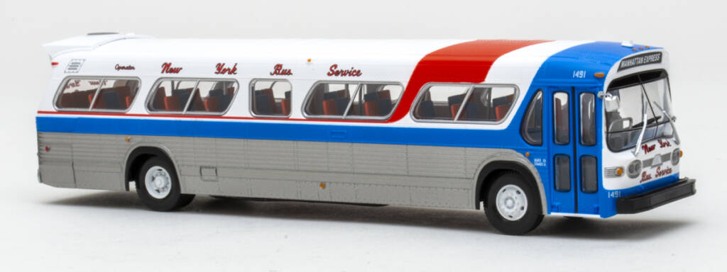 Color photo of HO scale bus painted red, white, blue, and silver on white background.