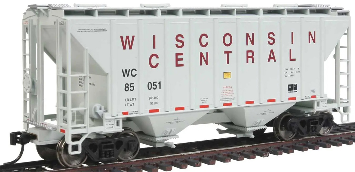 A white model freight car with red lettering that reads "Wisconsin Central"