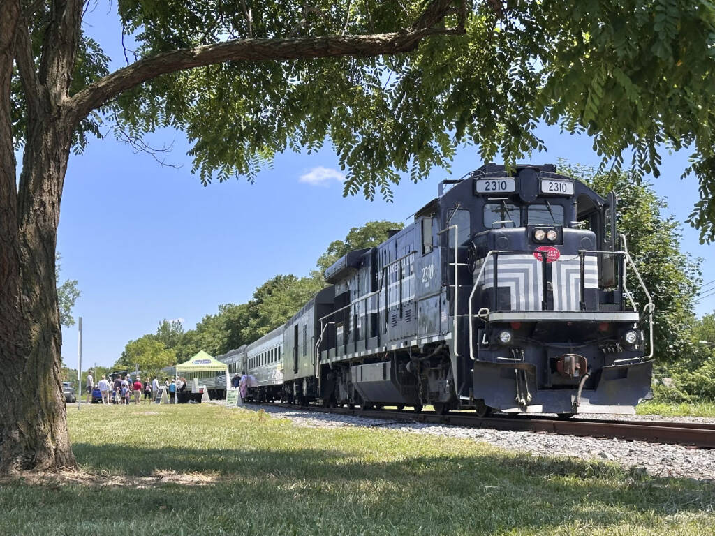 Diesel locomotive leading a passenger train. Auburn Road Special excursions to benefit United Railroad Historical Society of New Jersey.