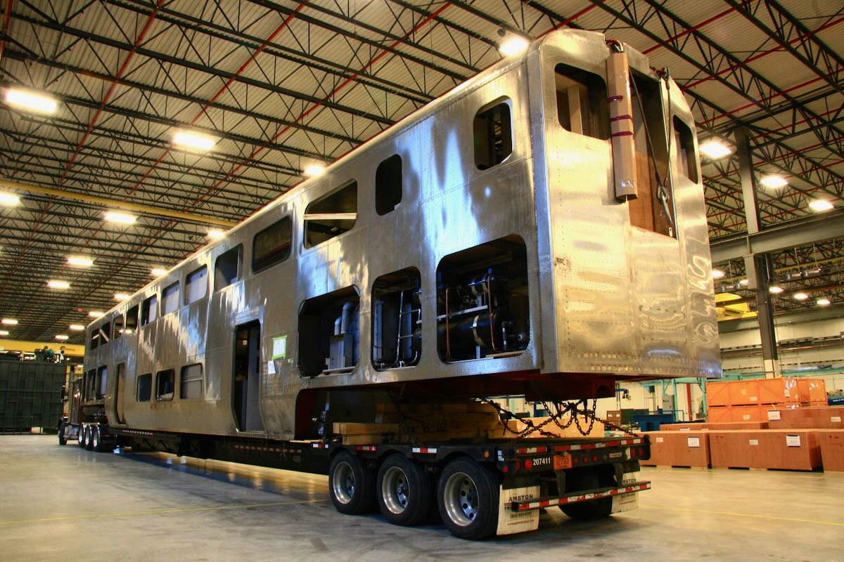 Shell of bilevel passenger car on truck trailer