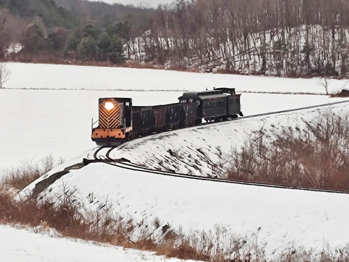 Short train on S curve in snow