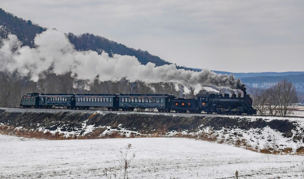 Steam engine and passenger train with caboose
