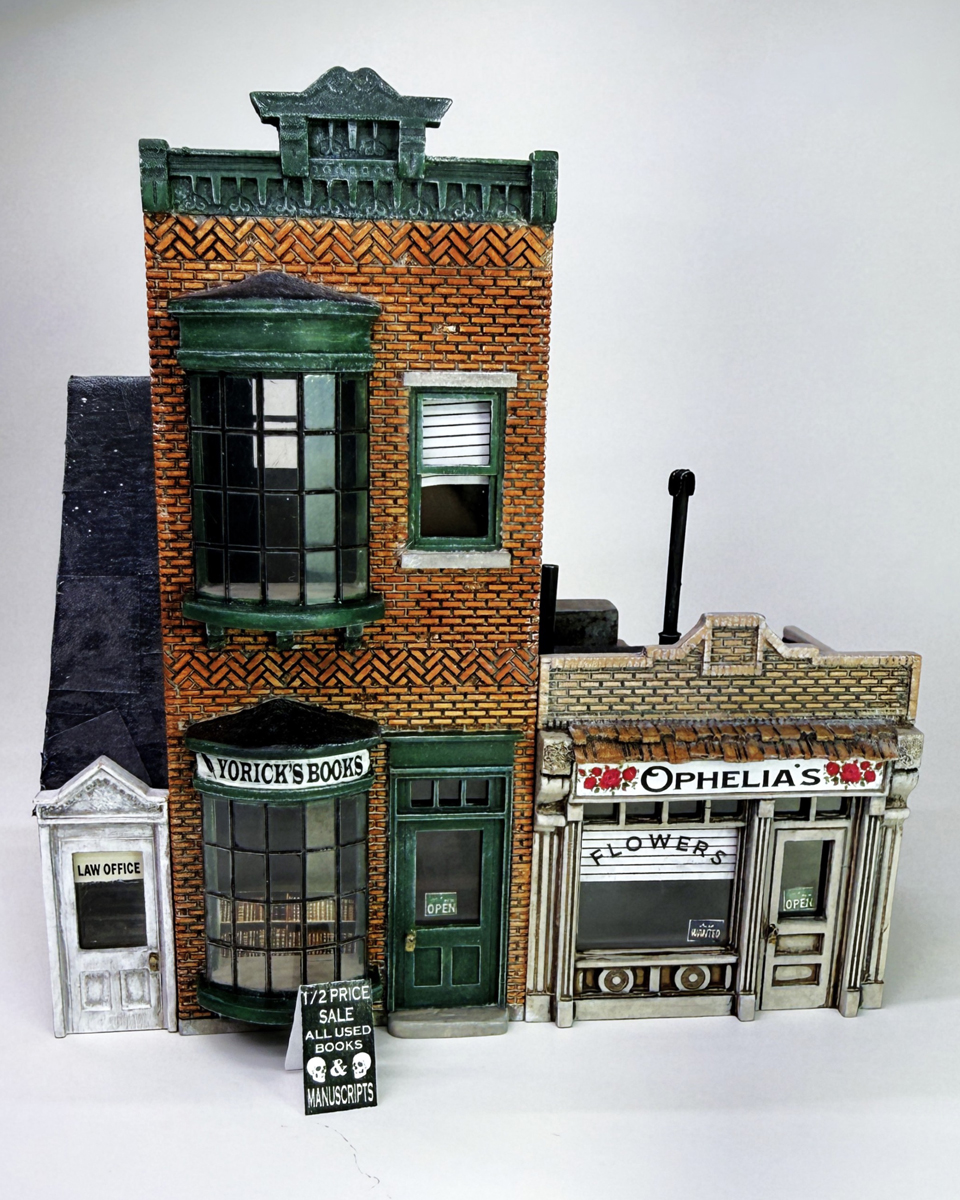 A model structure with retail businesses including a book shop and a flower shop