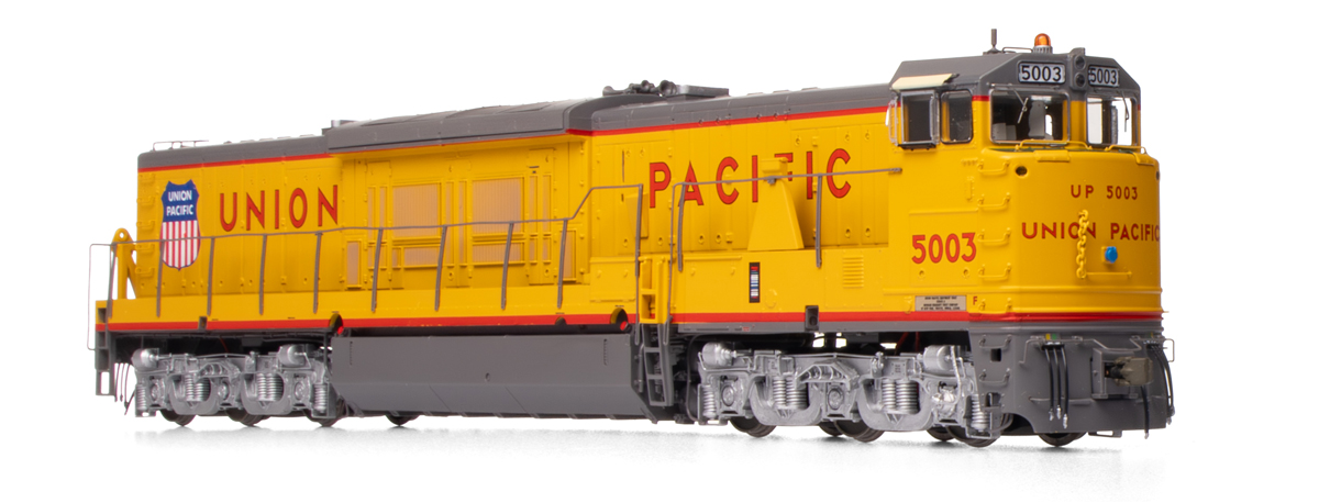 A yellow and gray model locomotive