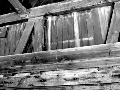 Interior of old wooden boxcar showing grain load levels. Restoring a World War II boxcar home.