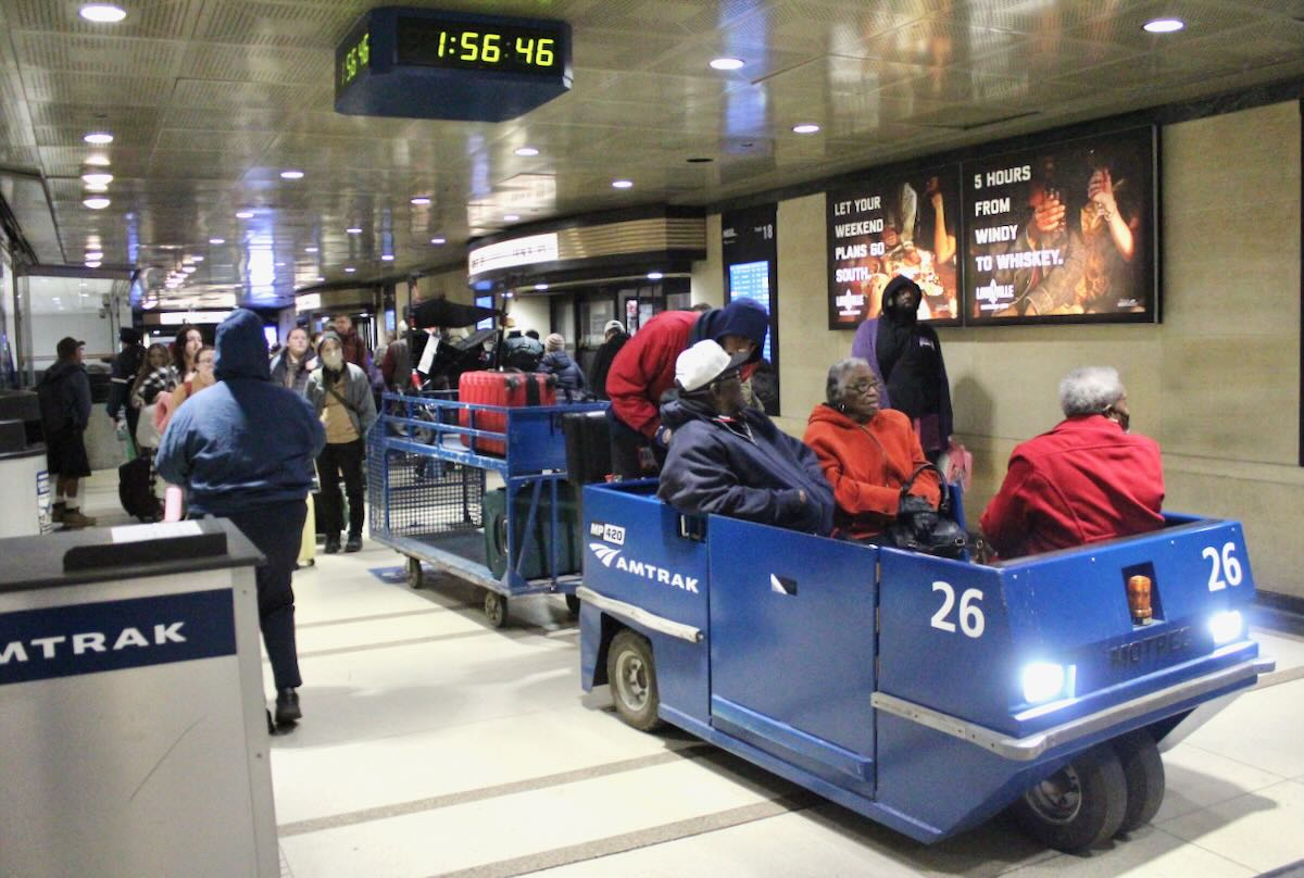Blue cart moving passengers in hallway at Chicago Union Station
