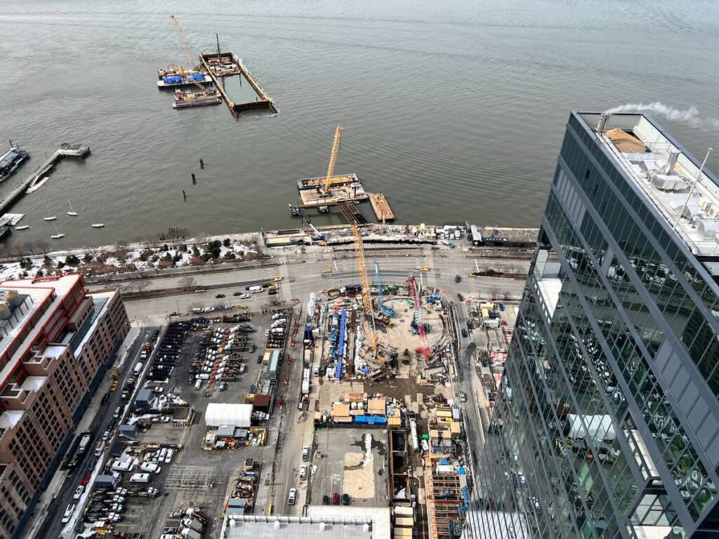 Aerial view of construction site at the edge of Manhattan