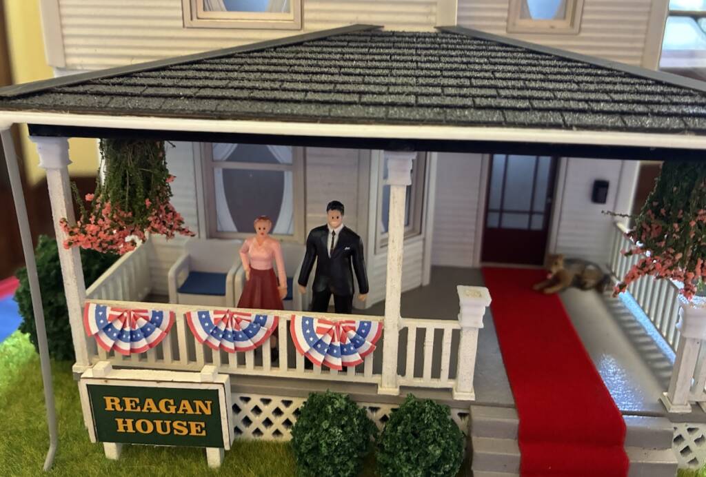 closeup of model house with figures